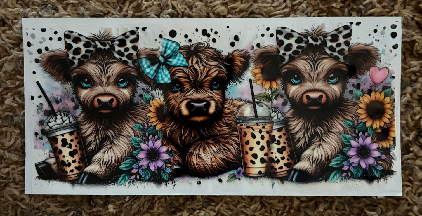 3 cows with cups